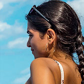 Cuban woman looking at sea.
